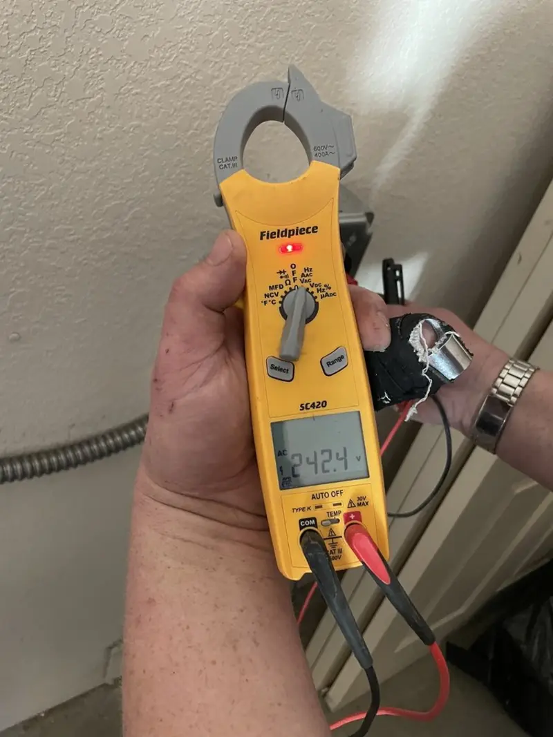 Voltage testing with clamp meter during Hot Tub / Pool Electrical Wiring in Brandon